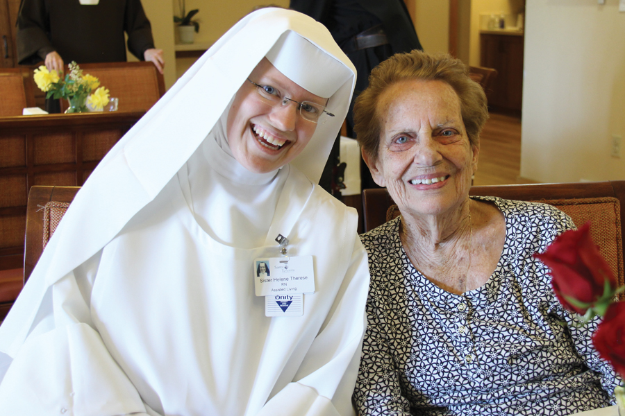 Sister and Resident Smiling at Camera