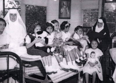 Early Years of Santa Teresita Sanatorium. Sisters with young TB patients
