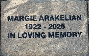 Example of an engraved brick at Santa Teresita reading "MARGIE ARAKELIAN 1922 - 2025 IN LOVING MEMORY"